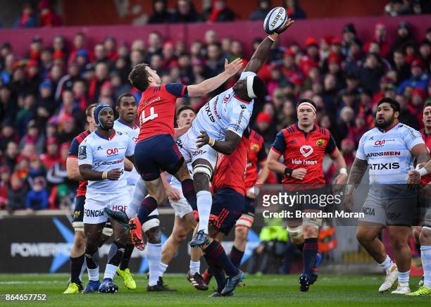 Limerick , Ireland - 21 October 2017; Yannick Nyanga of Racing 92 in action against Darren Sweetnam of Munster during the European Rugby Champions...