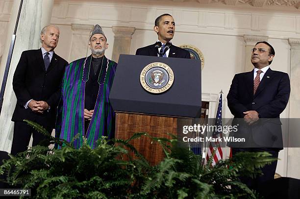 President Barack Obama speaks while flanked by Vice President Joseph Biden , Afghan President Hamid Karzai and Pakistani President Asif Ali Zardari...