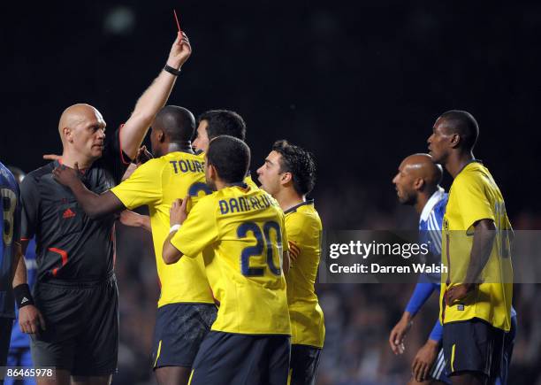 Samuel Eto'o of Barcelona and his team mates argues with referee Tom Henning Ovrebo after Eric Abidal of Barcelona received a red card during the...
