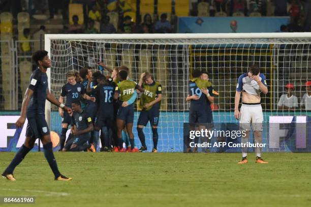 England's players celebrate after winning the the quarter-final football match between USA and England in the FIFA U-17 World Cup at the Jawaharlal...