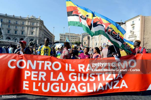 People attend a national protest against racism, titled "No one is illegal, migration is not a crime", on October 21, 2017 in Rome, Italy.