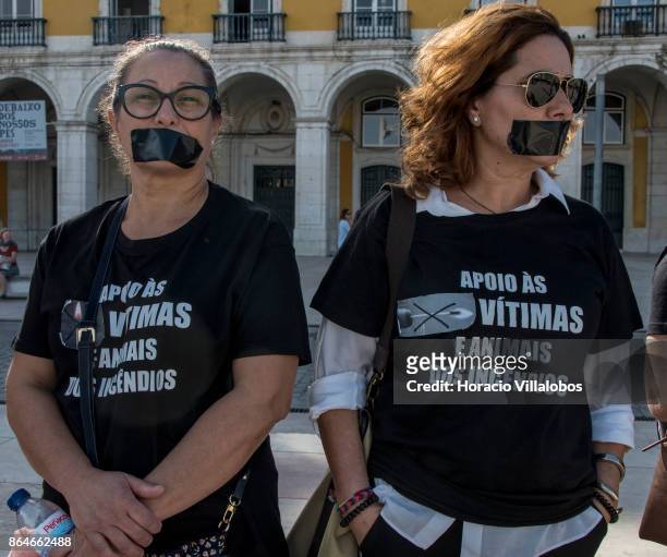 Demonstrators stage a protest against Portugal's recent forest fires at Praca do Comercio on October 21, 2017 in Lisbon, Portugal. A crowd of 2000...