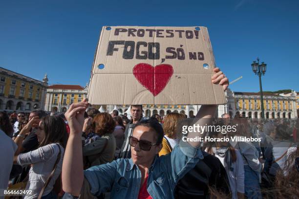 Demonstrators stage a protest against Portugal's recent forest fires at Praca do Comercio on October 21, 2017 in Lisbon, Portugal. A crowd of 2000...
