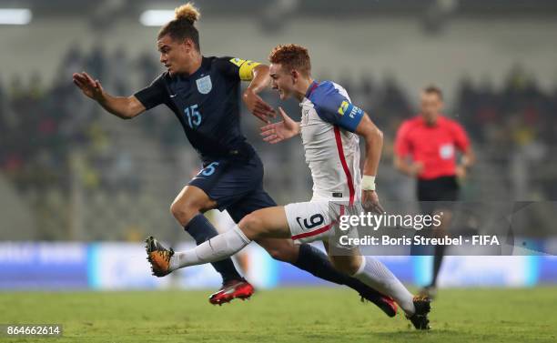 Joel Latibeaudiere of England is challenged by Josh Sargent of the United States during the FIFA U-17 World Cup India 2017 Quarter Final match...