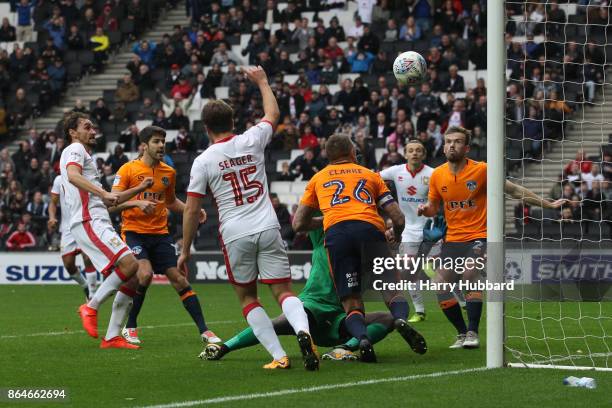 Ed Upson of Milton Keynes Dons scores his side's fourth goal during the Sky Bet League One match between Milton Keynes Dons and Oldham Athletic at...
