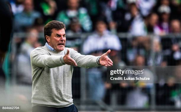 Head Coach Dieter Hecking of Moenchengladbach gestures on the sideline during the Bundesliga match between Borussia Moenchengladbach and Bayer 04...