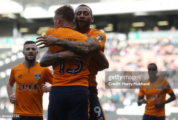 Craig Davies of Oldham Athletic celebrates scoring his side's first goal during the Sky Bet League One match between Milton Keynes Dons and Oldham...