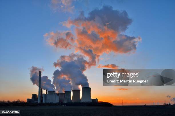 coal fired power station neurath i, backlight sunset. - coal fired power station stock pictures, royalty-free photos & images