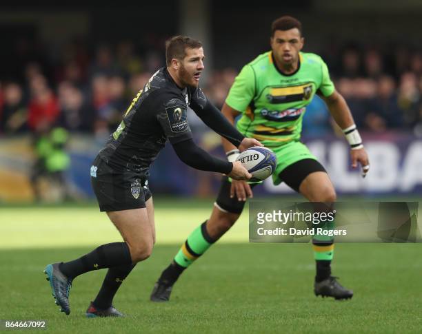 Camille Lopez of Clermont Auvergne passes the ball as Luther Burrell looks on during the European Rugby Champions Cup match between ASM Clermont...