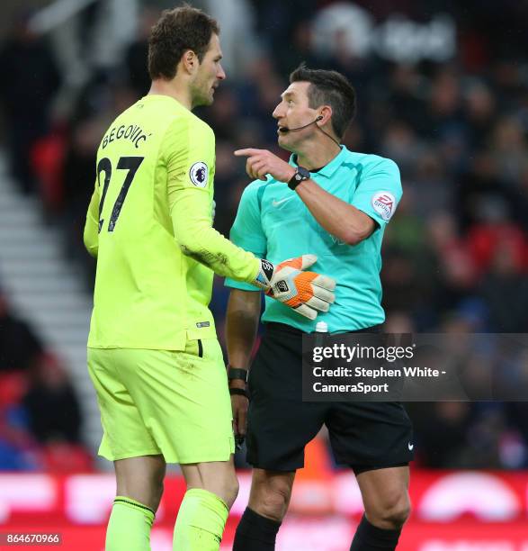 Referee Lee Probert in conversation with Bournemouth's goalkeeper Asmir Begovic during the Premier League match between Stoke City and AFC...