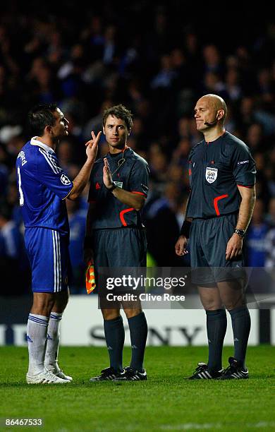 Frank Lampard of Chelsea argues with referee Tom Henning Ovrebo during the UEFA Champions League Semi Final Second Leg match between Chelsea and...