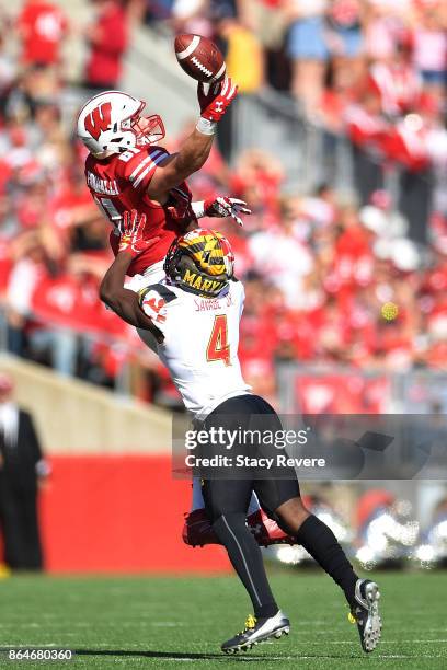 Troy Fumagalli of the Wisconsin Badgers is defended by Darnell Savage Jr. #4 of the Maryland Terrapins during the second quarter at Camp Randall...