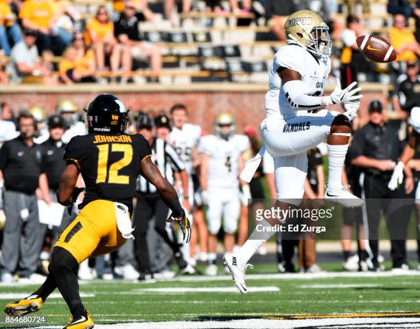 Armond Hawkins of the Idaho Vandals intercepts a pass intended for Johnathon Johnson of the Missouri Tigers in the first quarter at Memorial Stadium...
