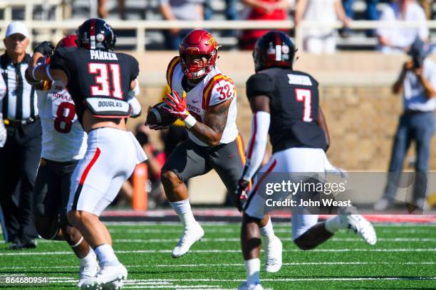 David Montgomery of the Iowa State Cyclones looks for running room against the Texas Tech Red Raiders during the game on October 21, 2017 at Jones...