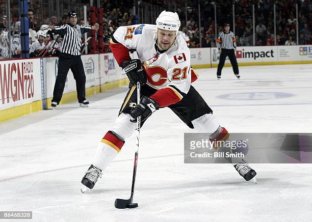 Olli Jokinen of the Calgary Flames takes the puck down the ice during game 5 of the Western Conference Quarterfinals of the 2009 Stanley Cup Playoffs...