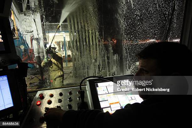 Driller monitors his touch screen control panel on a natural gas drilling platform on December 16, 2008 in Fort Worth, Texas. Drilling technology and...