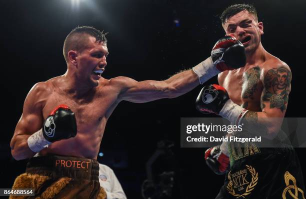 Belfast , United Kingdom - 21 October 2017; Renald Garrido, left, exchanges punches with Tyrone McKenna during their Super-Lighweight bout at the SSE...