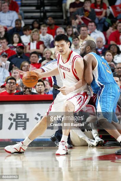 Yao Ming of the Houston Rockets goes up against Melvin Ely of the New Orleans Hornets during the game on April 13, 2009 at the Toyota Center in...