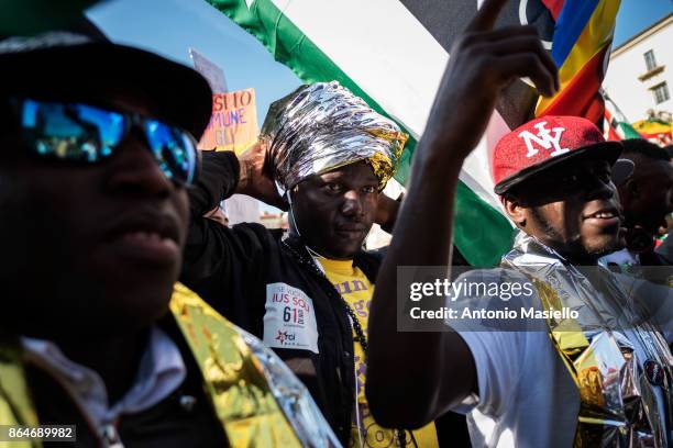 People protest during a national demonstration for refugees civil rights and against the racism, titled 'No one is illegal, migration is not a...