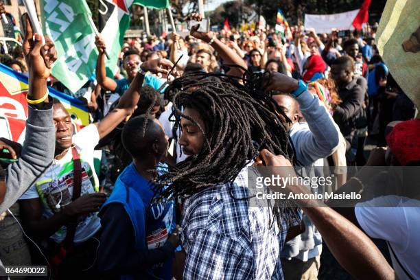 People protest during a national demonstration for refugees civil rights and against the racism, titled 'No one is illegal, migration is not a...