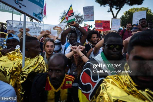 People protest during a national demonstration for refugees civil rights and against the racism, titled 'No one is illegal, migration is not a...