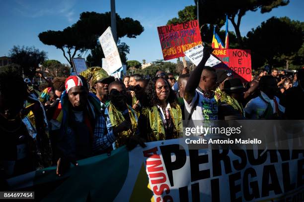 People protest during a national demonstration for refugees civil rights and against the racism, titled 'No one is illegal, migration is not a...