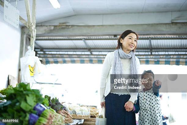 grandmother and granddaughter shopping at store - 商店 ストックフォトと画像