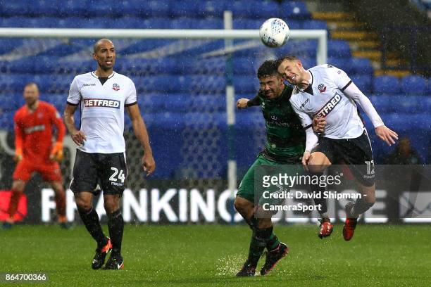 Bolton Wanderers' Craig Noone battles with Queens Park Rangers' Massimo Luongo during the Sky Bet Championship match between Bolton Wanderers and...