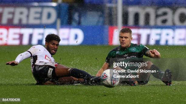 Bolton Wanderers' Mark Little battles with Queens Park Rangers' Jake Bidwell during the Sky Bet Championship match between Bolton Wanderers and...