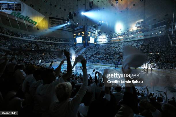 Pittsburgh Penguins fans wave their towels as the Penguins take the ice for Game Three of the Eastern Conference Semifinal Round of the 2009 Stanley...