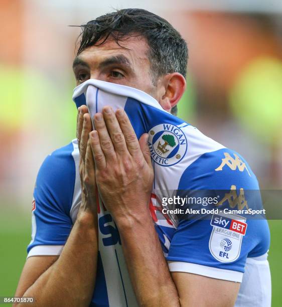 Wigan Athletic's Gary Roberts leaves the field during the Sky Bet League One match between Blackpool and Wigan Athletic at Bloomfield Road on October...