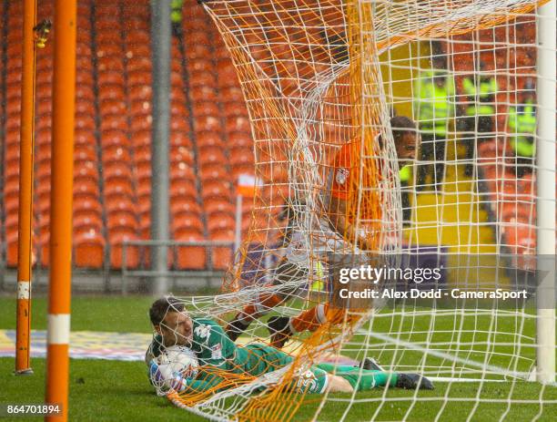 Blackpool's Kyle Vassell gets caught in the net after opening the scoring during the Sky Bet League One match between Blackpool and Wigan Athletic at...