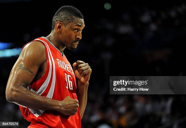 Ron Artest of the Houston Rockets looks over at a fan in the second quarter against the Los Angeles Lakers in Game Two of the Western Conference...