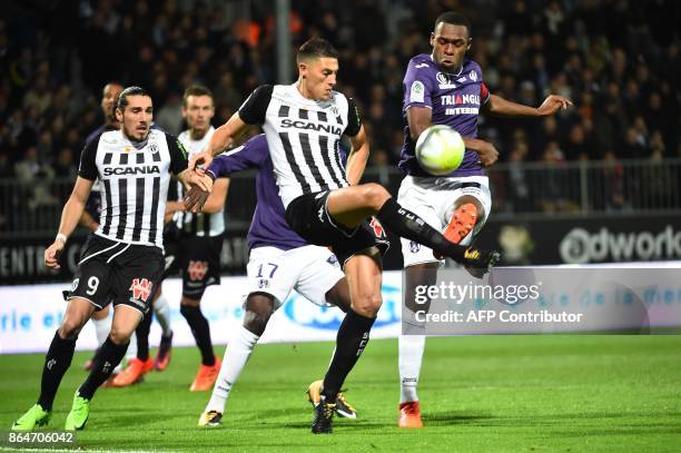 Angers's Algerian defender Mehdi Tahrat vies with Toulouse's French defender Issa Diop during the French L1 football match between Angers and...