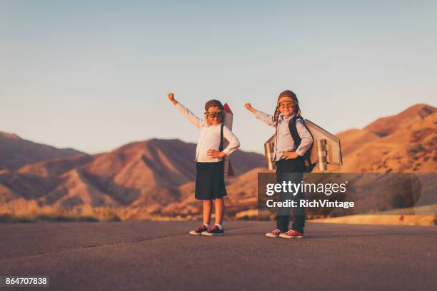 young business girls wearing rockets - jet pack stock pictures, royalty-free photos & images