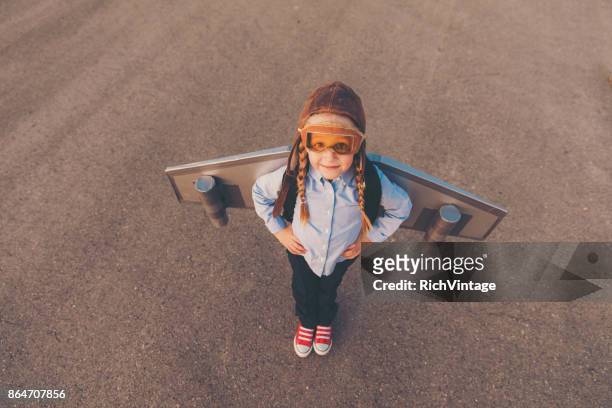 young business girl with jet pack - rocket pack stock pictures, royalty-free photos & images