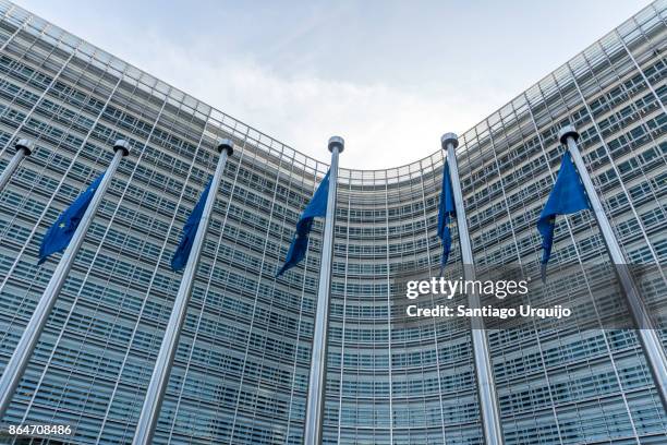 european union flags at berlaymont building of the european commission - european union symbol stock pictures, royalty-free photos & images