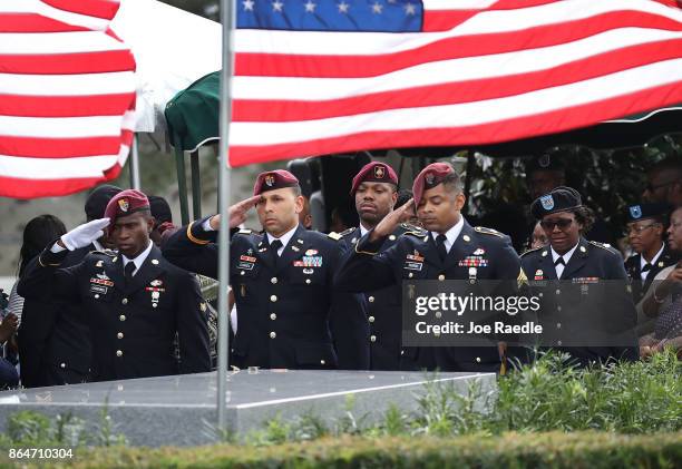 Members of the 3rd Special Forces Group 2nd battalion Fse salute the casket of U.S. Army Sgt. La David Johnson at his burial service in the Memorial...