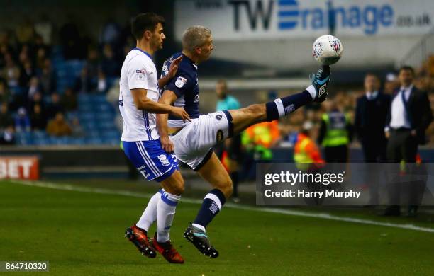 Steve Morison of Millwall attempts to control the ball under pressure from Maxime Colin of Birmingham City during the Sky Bet Championship match...