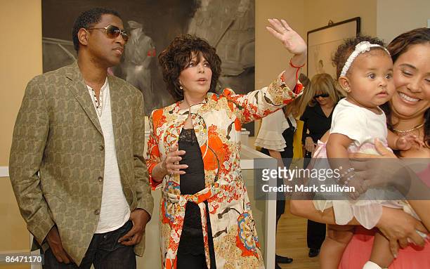 Kenneth 'Babyface' Edmonds, Carole Bayer Sager and Nicole Patenburg holding daughter Peyton Edmonds attend "Wounded" curated by Carole Bayer Sager at...