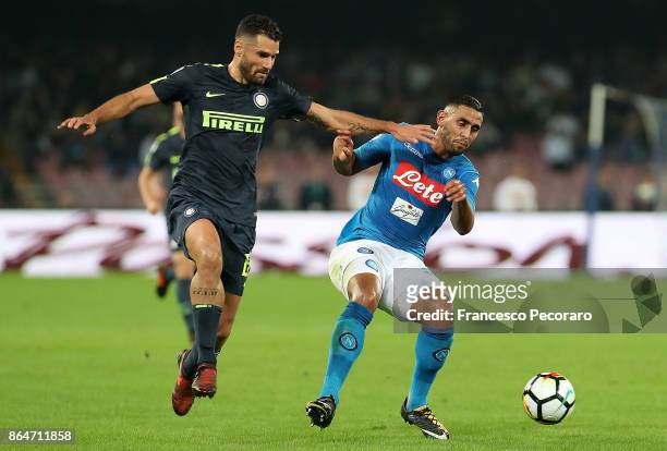 Player of SSC Napoli Faouzi Ghoulam vies with FC Internazionale player Antonio Candreva during the Serie A match between SSC Napoli and FC...
