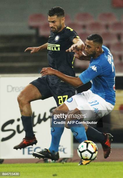 Napoli's Algerian defender Faouzi Ghoulam vies with Inter Milan's Italian midfielder Antonio Candreva during the Italian Serie A football match SSC...