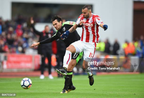 Jese of Stoke City tackles Charlie Daniels of AFC Bournemouth during the Premier League match between Stoke City and AFC Bournemouth at Bet365...