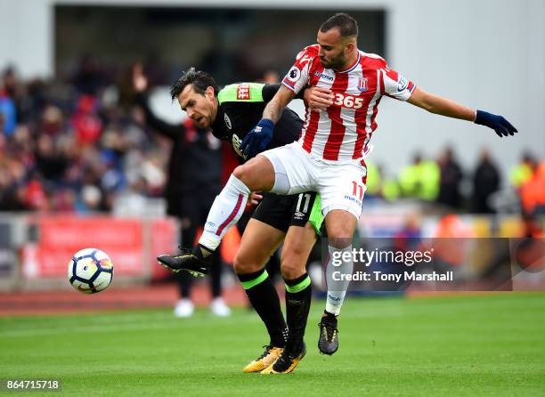 Jese of Stoke City tackles Charlie Daniels of AFC Bournemouth during the Premier League match between Stoke City and AFC Bournemouth at Bet365...
