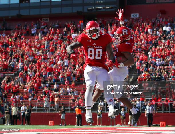 Raheem Blackshear of the Rutgers Scarlet Knights celebrates his 35 yard touchdown with Nixon Provillon against the Purdue Boilermakers during the...