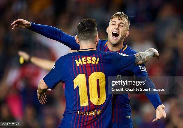 Gerard Deulofeu of Barcelona celebrates with Lionel Messi of Barcelona after scoring the first goal during the La Liga match between Barcelona and...