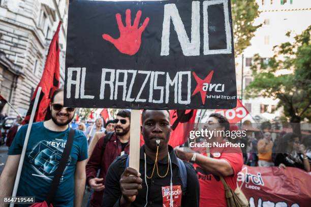 Refugees and asylum seekers march downtown during the 'Non è reato' national demonstration to protest against racism and to ask justice and equality...