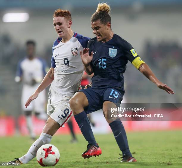 Josh Sargent of the United States battles for the ball with Joel Latibeaudiere of England during the FIFA U-17 World Cup India 2017 Quarter Final...