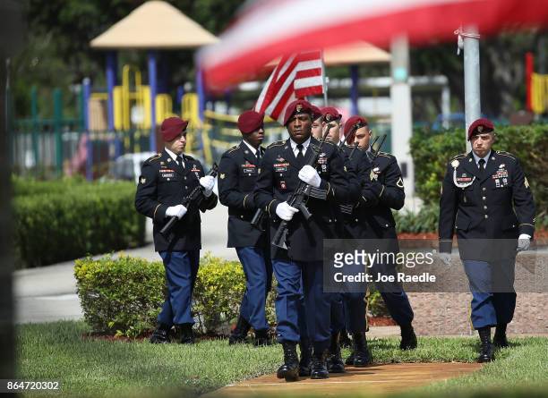 Military honor guards prepare for the 21 gun salute for U.S. Army Sgt. La David Johnson during his burial service at the Memorial Gardens East...