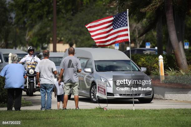 The hearse carrying U.S. Army Sgt. La David Johnson arrives for his burial service at the Memorial Gardens East cemetery on October 21, 2017 in...